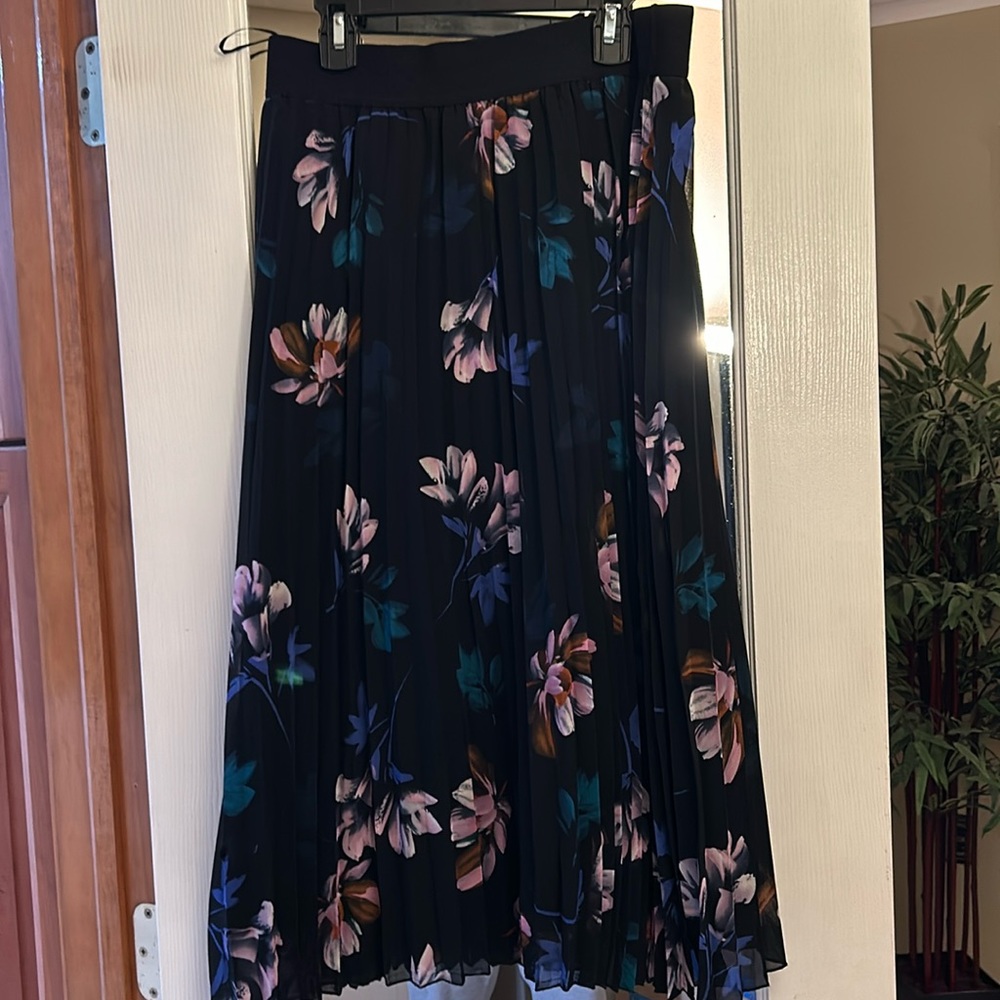 New without tags. Beautiful black floral midi skirt.